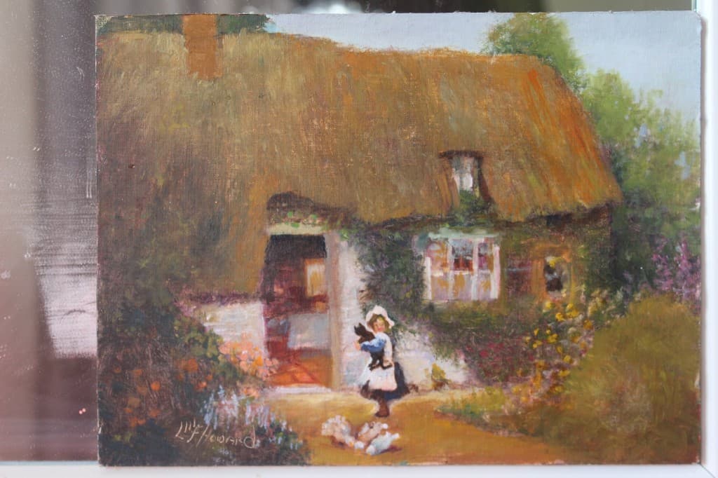 Impressionistic oil painting of a girl in a white apron on a garden path before a thatched cottage with flowering borders