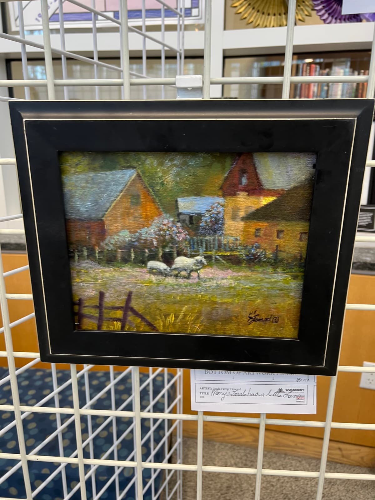 Impressionist oil painting of a sunlit countryside village with red-roofed houses and a wooden fence